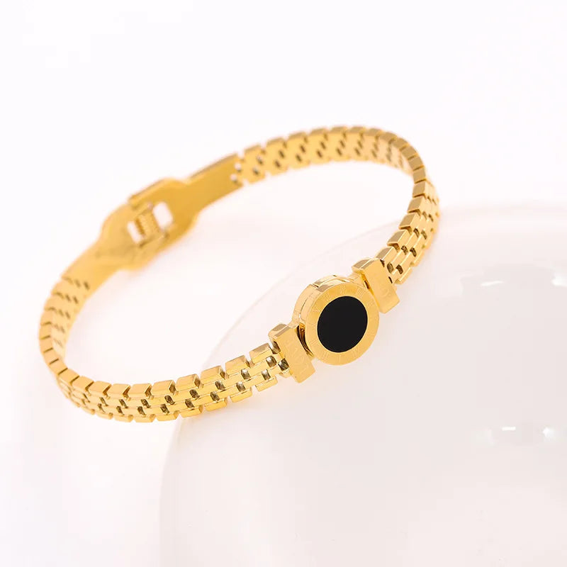 Bracelet en acier inoxydable et titane, plaqué or et zircons incrustés